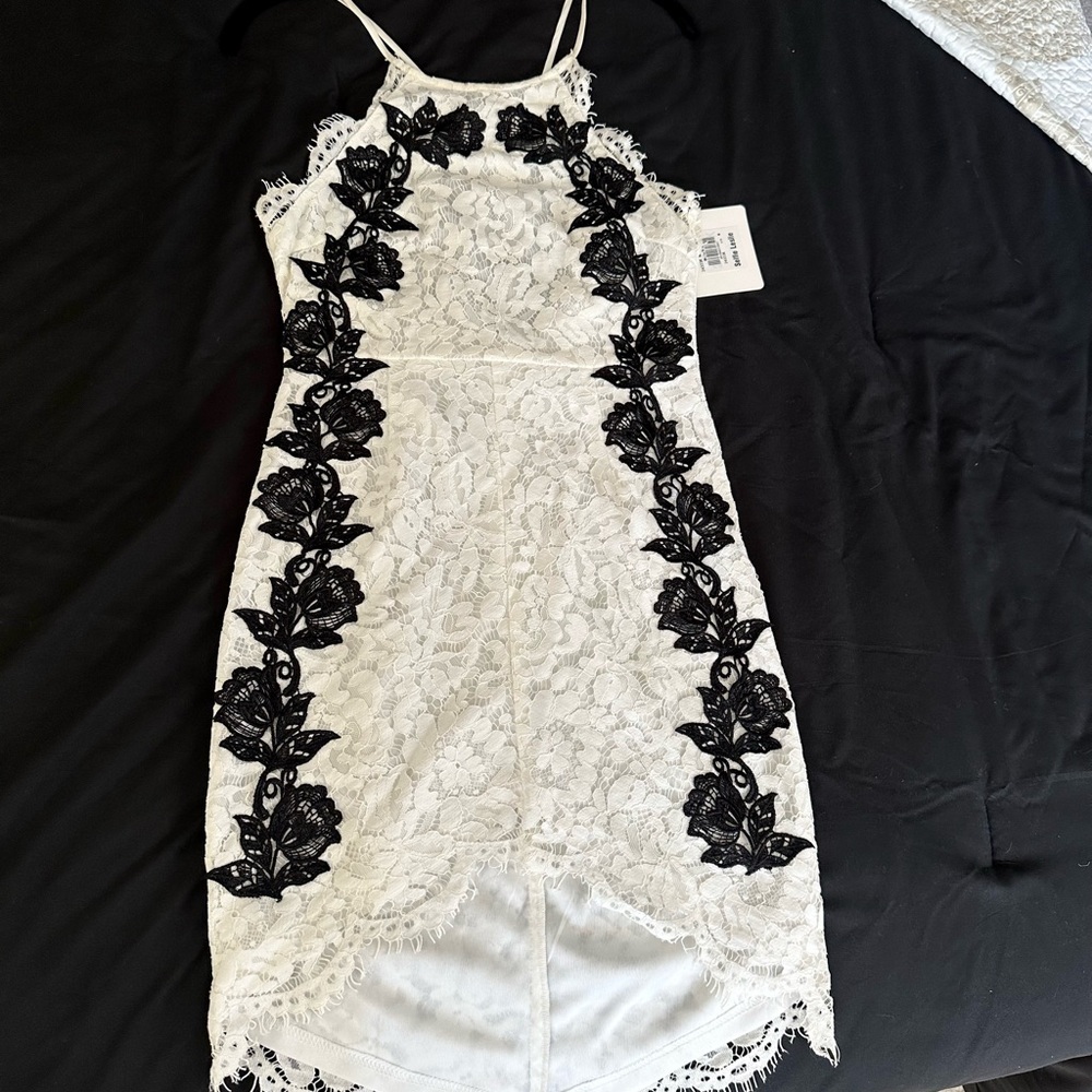Elegant White Lace Dress with Black Floral Accents